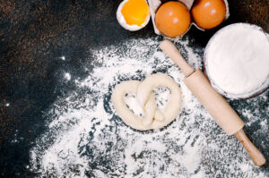 raw pretzel dough on floured table