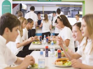 students having lunch in dining hall