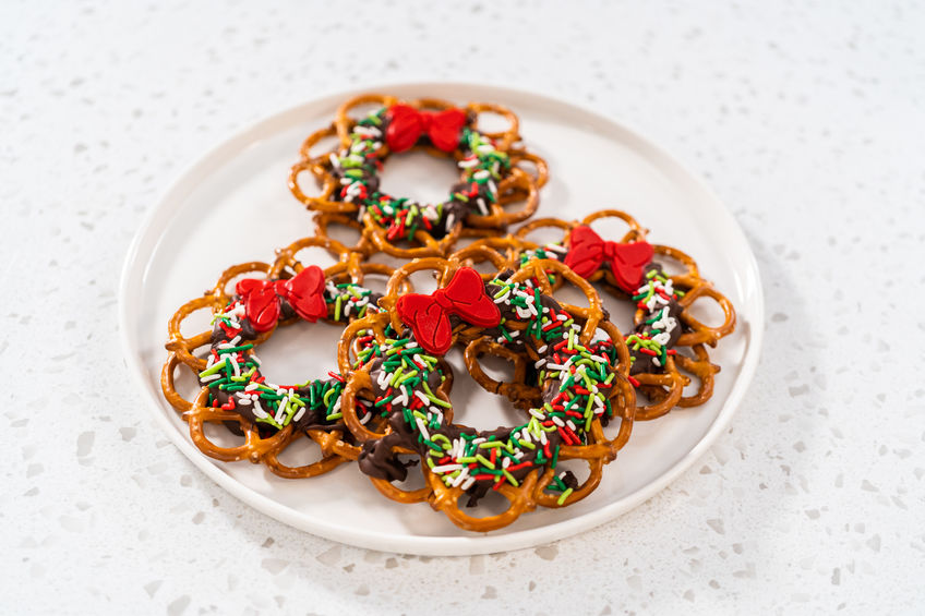Chocolate pretzel Christmas wreath on a white plate.